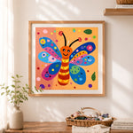 Finished smiling cartoon butterfly cross stitch artwork displayed as home decor