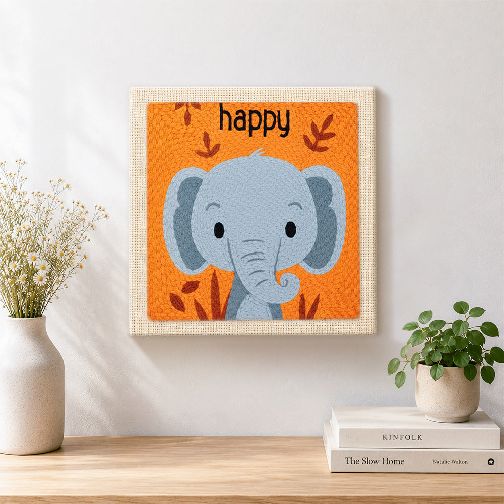 Finished smiling gray elephant artwork displayed on a wall