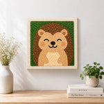 Finished smiling hedgehog artwork displayed on a wall