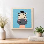 Finished smiling zebra head artwork displayed on a wall