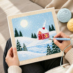 Creating handmade snow cabin in moonlight punch needle artwork