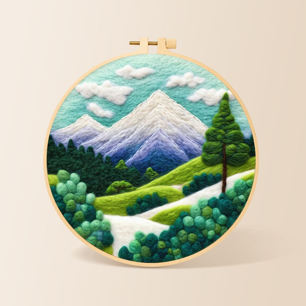 Snow-capped peaks and green trees needle felting kit for beginners with a round wooden frame