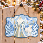 Snow forest santa scene paint by numbers door hanger on a garden gate