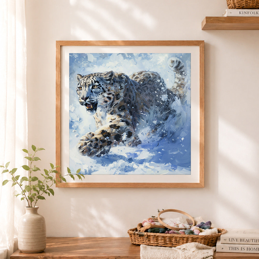 Finished snow leopard in motion cross stitch artwork displayed as home decor