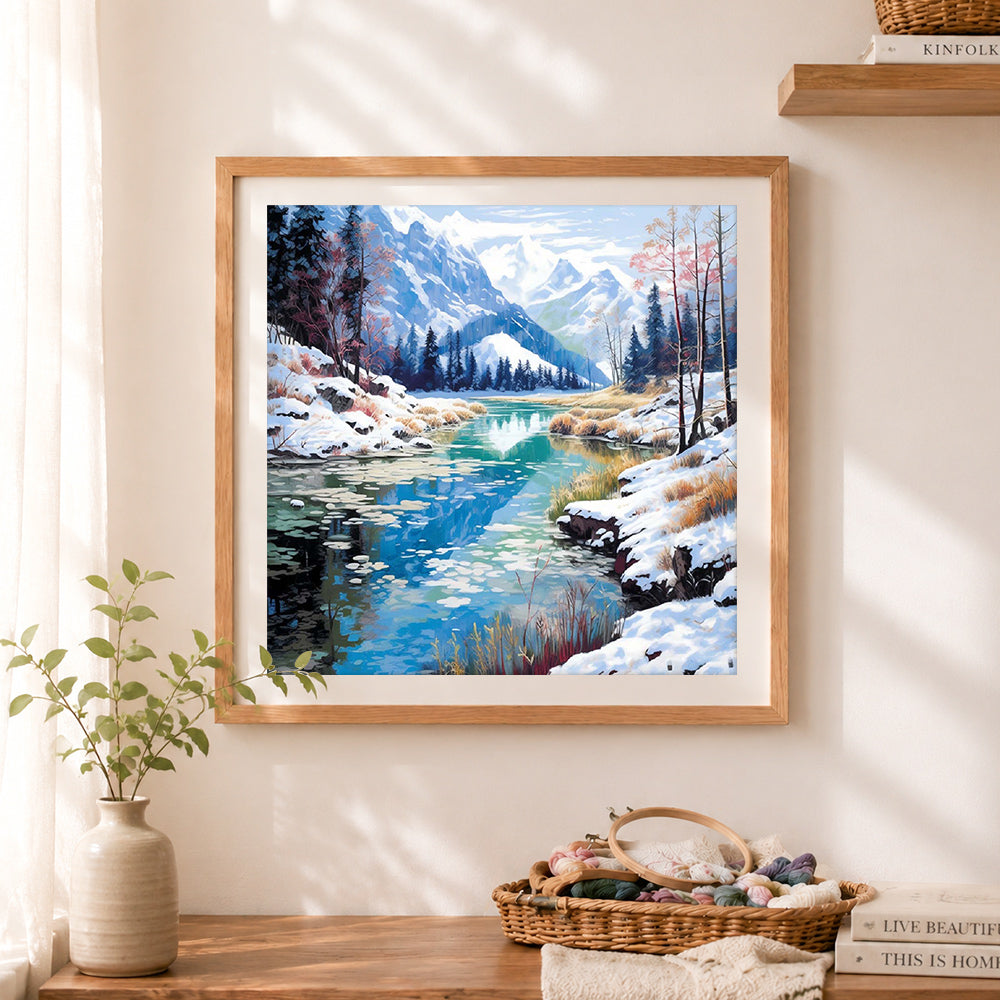 Finished snow mountain lake scenery cross stitch artwork displayed as home decor