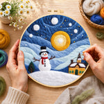 Creating the snowman and swirling starry night sky wool painting by hand with a felting needle