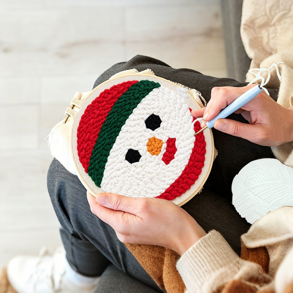 Creating handmade snowman face unch needle artwork