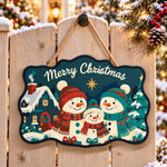 Snowman family with cozy cottage paint by numbers door hanger on a garden gate