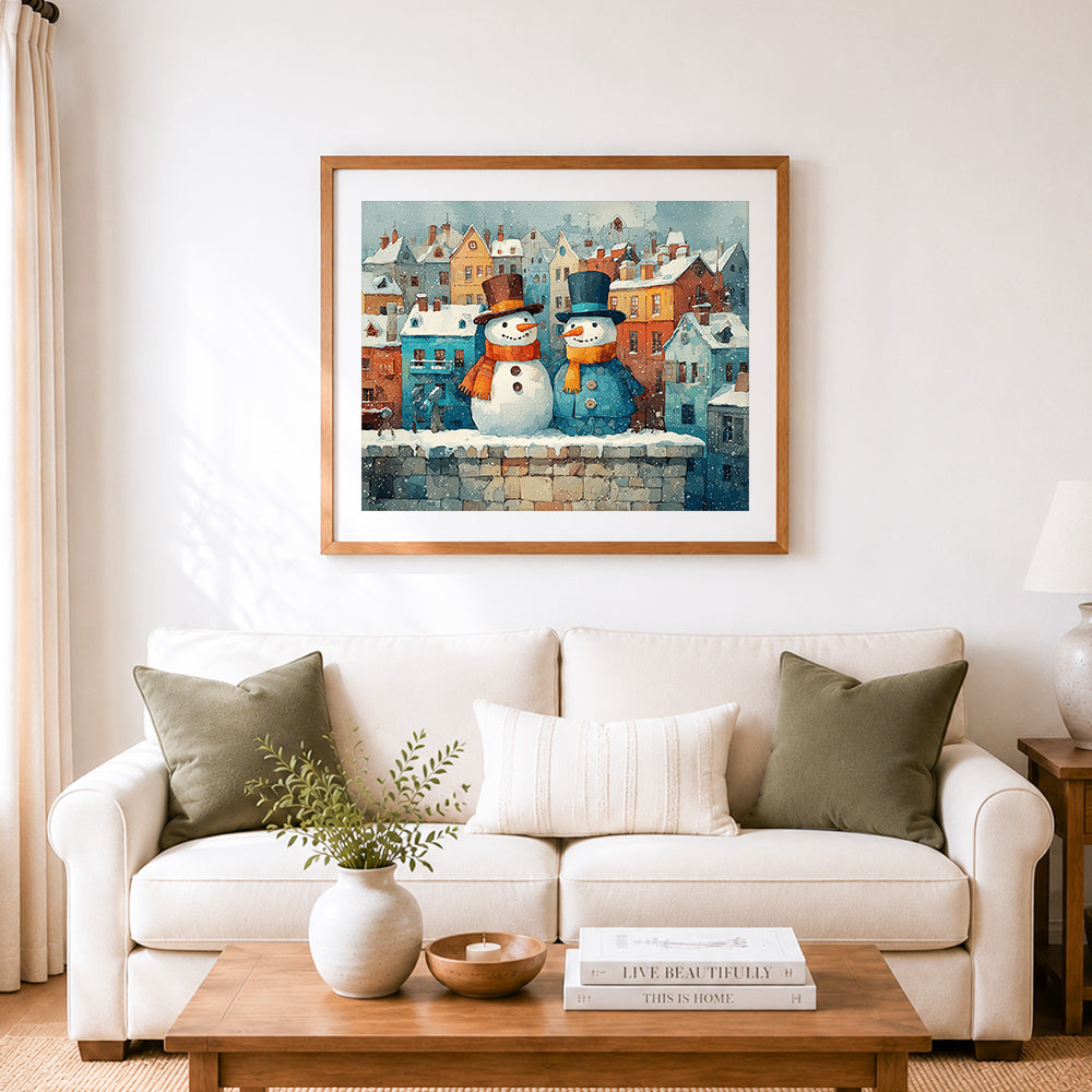 Finished snowmen on rooftop cross stitch artwork displayed as home decor