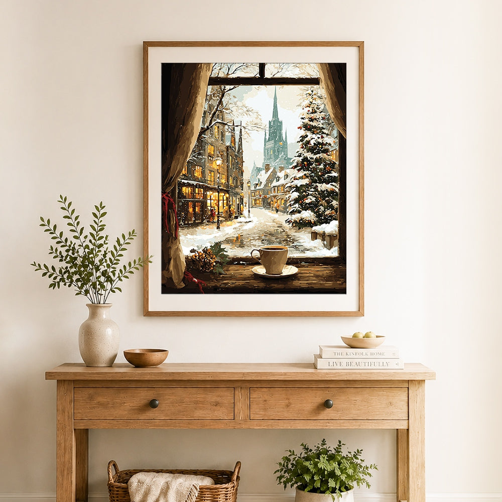Finished snowy christmas city from window view cross stitch artwork displayed as home decor