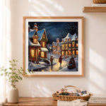 Finished snowy christmas street cross stitch artwork displayed as home decor