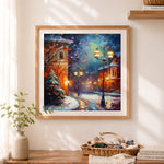 Finished snowy european night street scene cross stitch artwork displayed as home decor