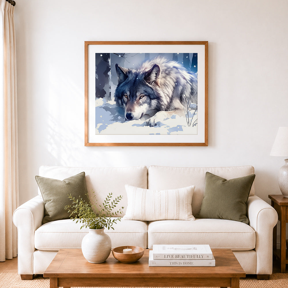 Finished snowy gray wolf resting in winter forest cross stitch artwork displayed as home decor