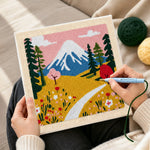 Creating handmade snowy mountain and wildflowers punch needle artwork