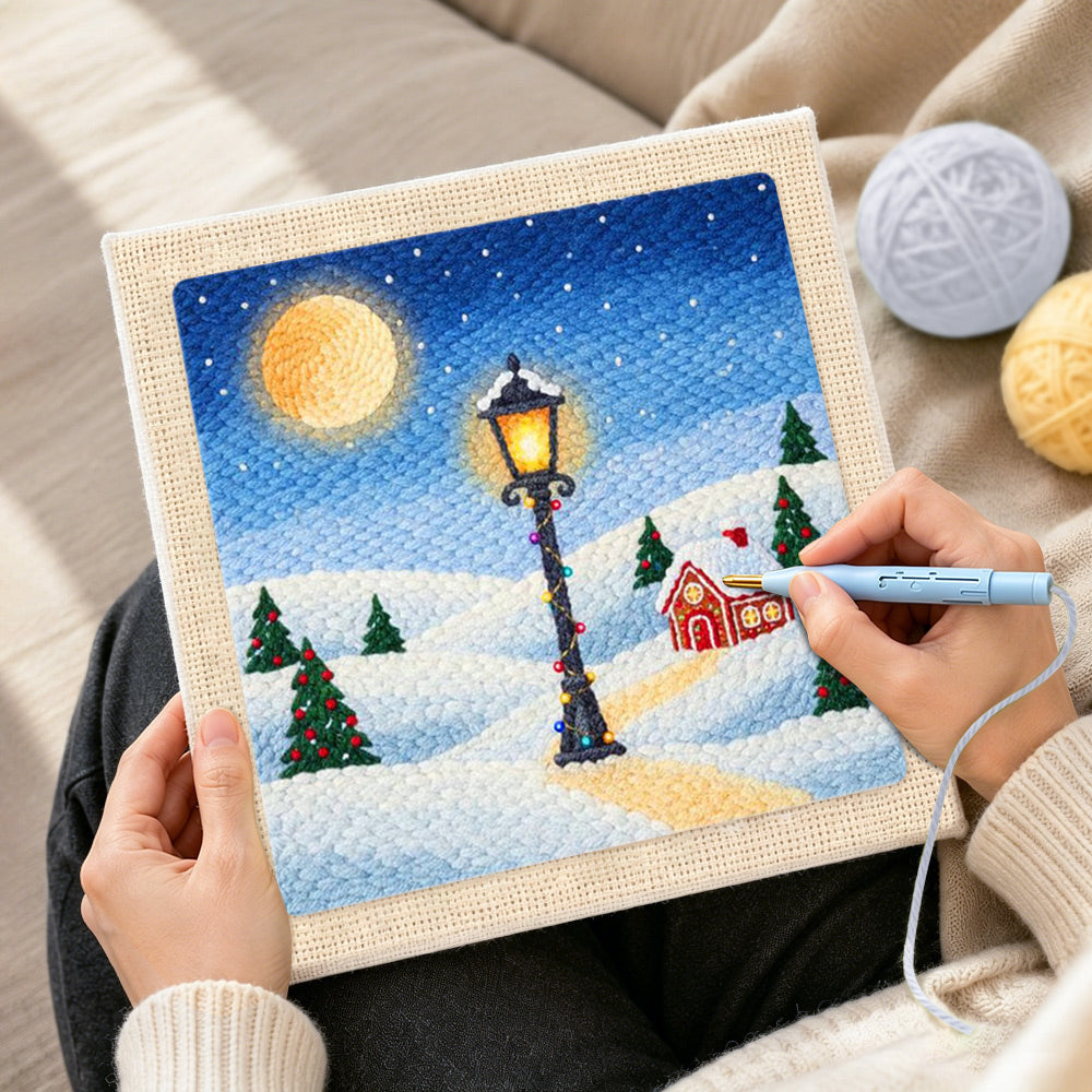 Creating handmade snowy street lamp scene punch needle artwork