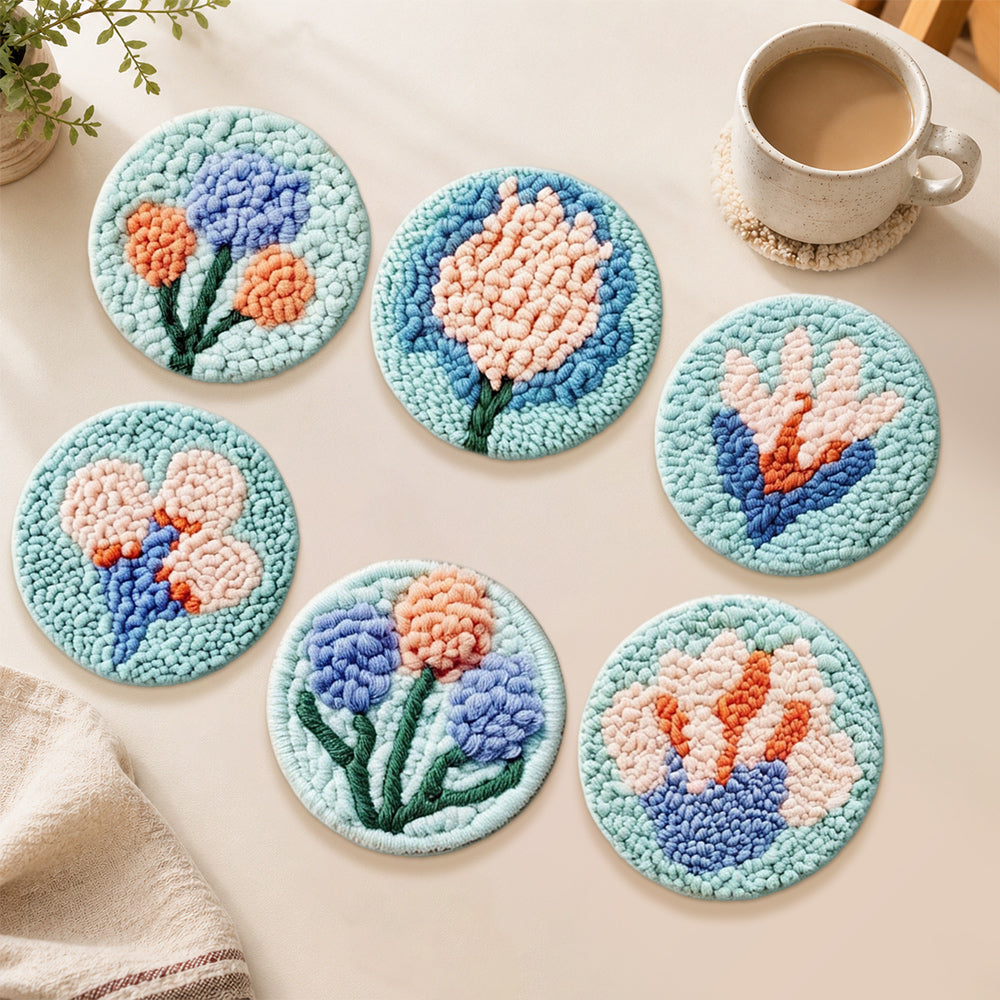 Soft blue and peach tufted flowers punch needle coasters used for home decoration