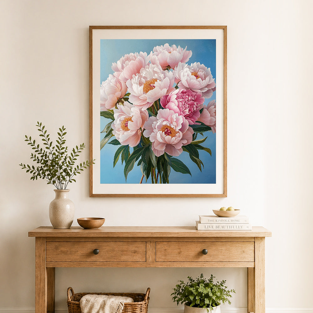 Finished soft blush peonies cross stitch artwork displayed as home decor