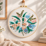 Soft pastel blooms and letter b embroidery hoop wall art displayed as warm and cozy handmade home decor