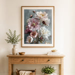 Finished soft pink and white peonies cross stitch artwork displayed as home decor
