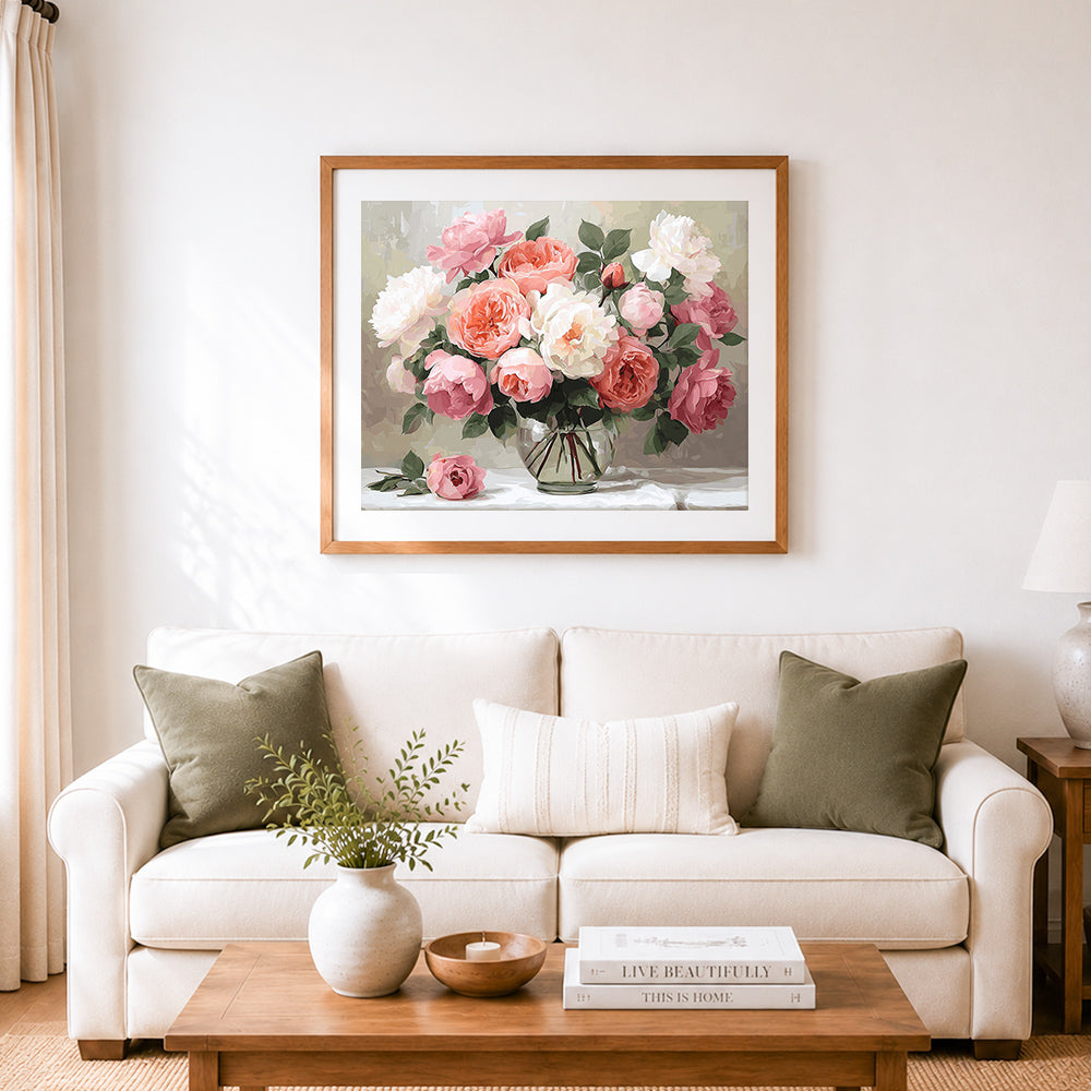 Finished soft pink and white peony roses in vase cross stitch artwork displayed as home decor