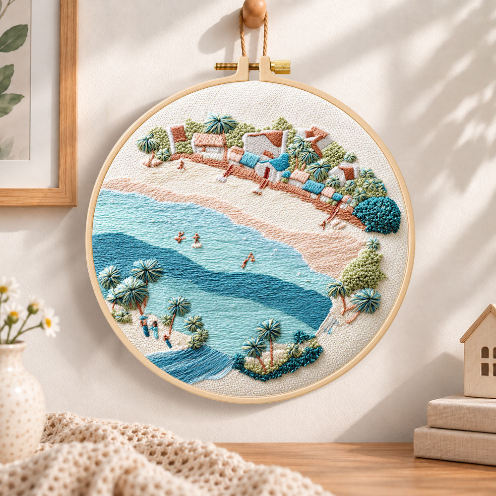 Soft seaside town embroidery hoop wall art displayed as warm and cozy handmade home decor