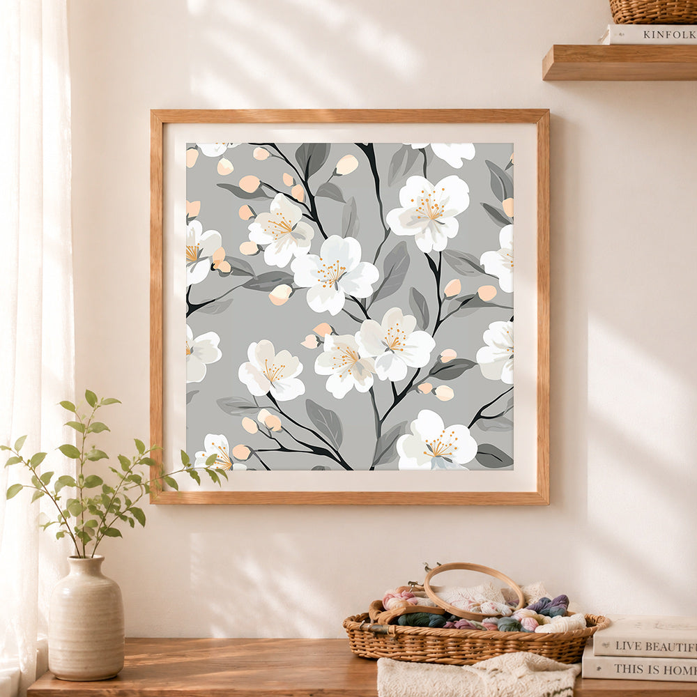 Finished soft white cherry blossom pattern cross stitch artwork displayed as home decor