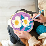 Creating handmade soft white flowers punch needle artwork