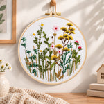 Soft wild daisy mix embroidery hoop wall art displayed as warm and cozy handmade home decor