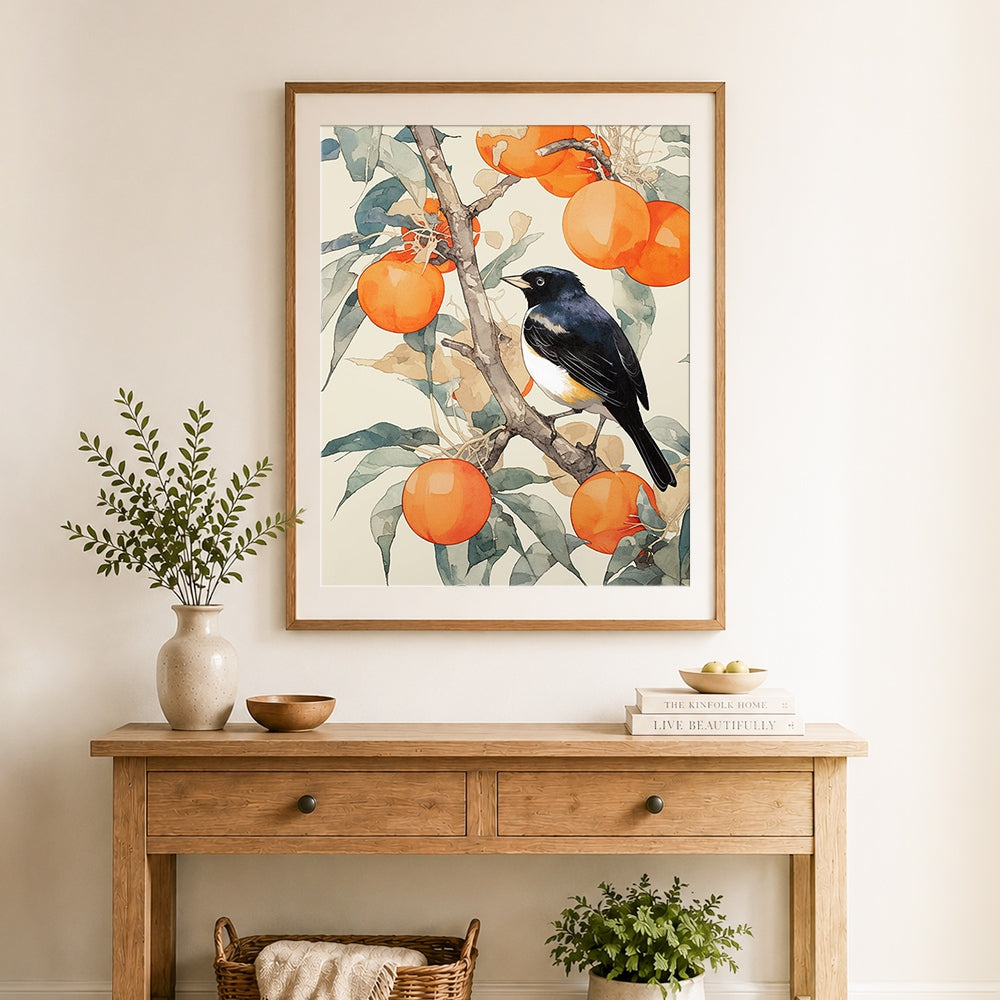 Finished songbird on persimmon branch cross stitch artwork displayed as home decor