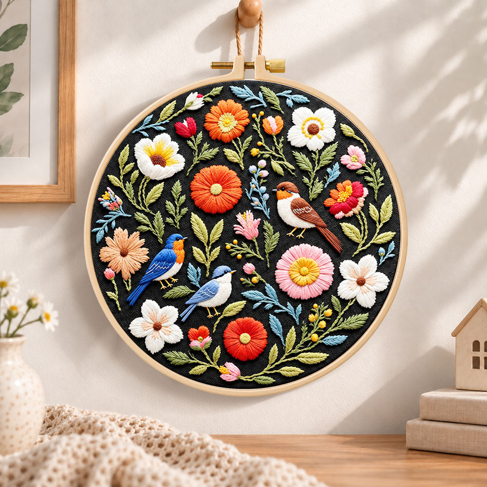 Songbirds and vibrant blooms embroidery hoop wall art displayed as warm and cozy handmade home decor