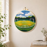 Spacious football pitch needle felt wall art displayed in a bright home interior