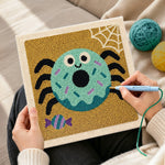 Creating handmade spider donut punch needle artwork