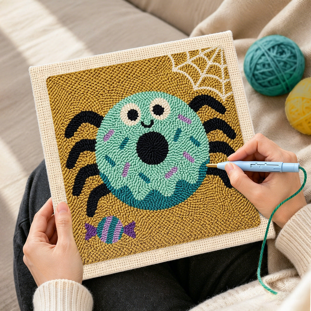 Creating handmade spider donut punch needle artwork