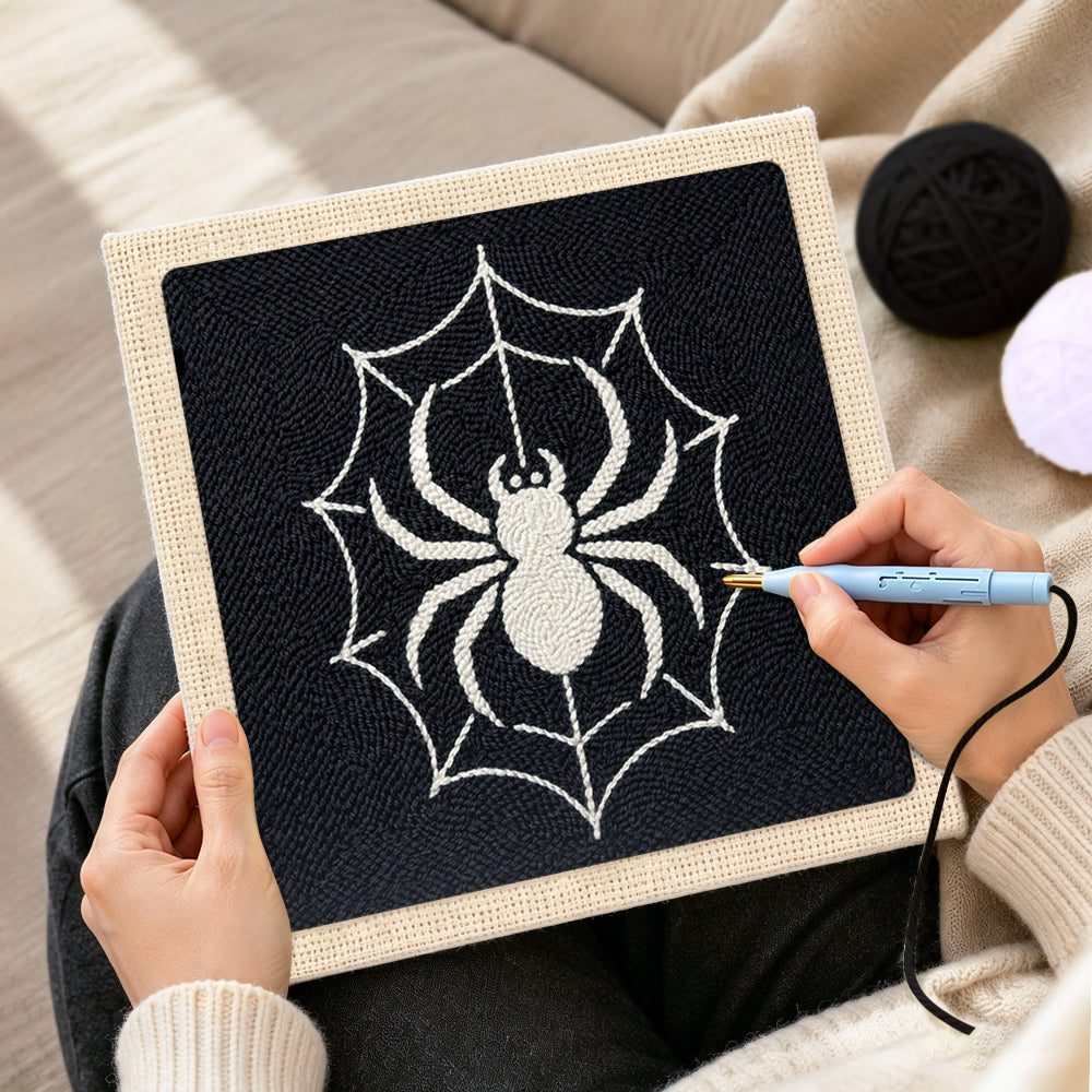 Creating handmade spider on web punch needle artwork