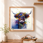 Finished splatter‑style highland cow cross stitch artwork displayed as home decor