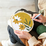 Creating handmade split-tone dandelion flower punch needle artwork