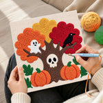 Creating handmade spooky autumn tree punch needle artwork