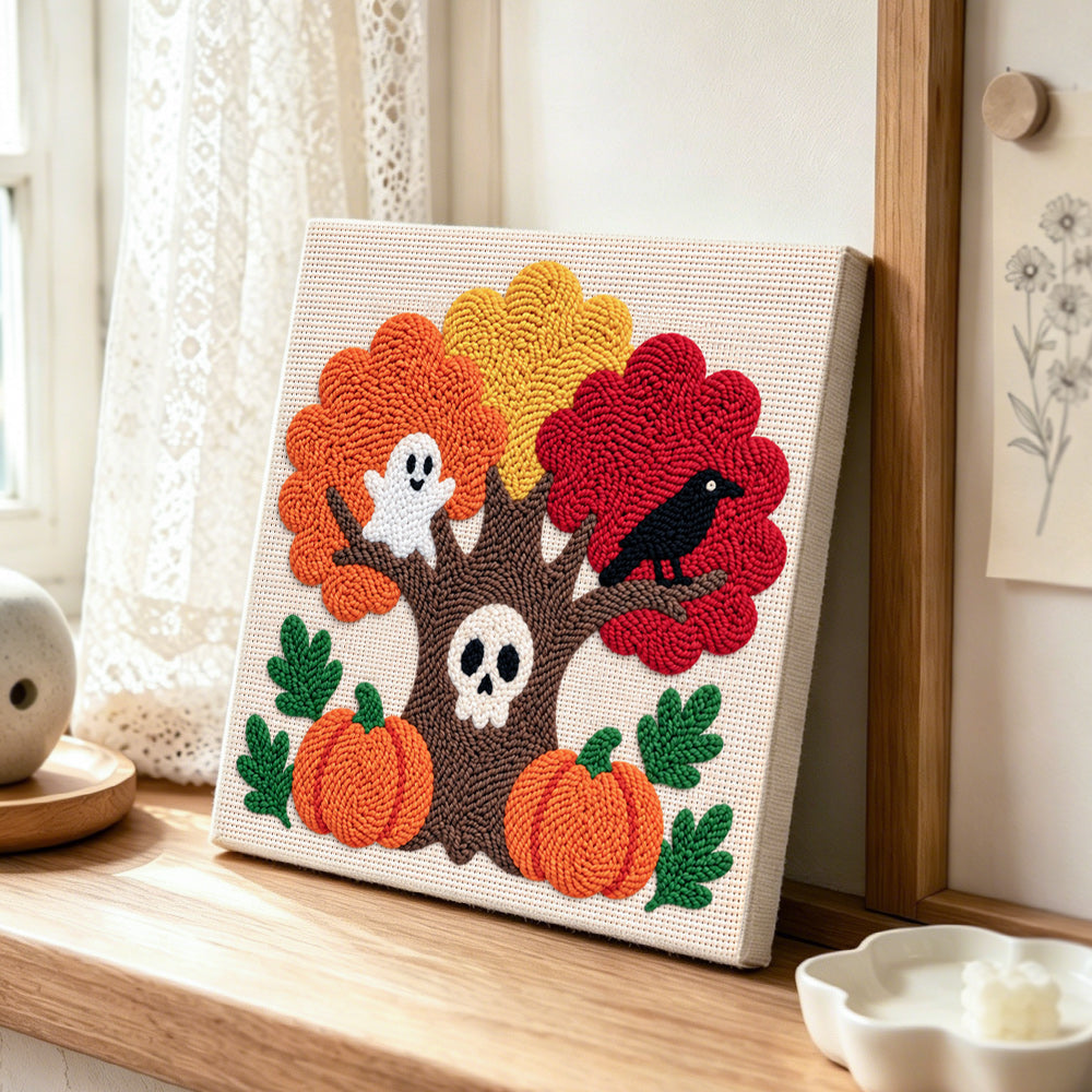 Spooky autumn tree punch needle artwork displayed on a table