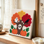 Spooky autumn tree punch needle artwork displayed on a table