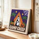 Spooky camp creep punch needle artwork displayed on a table