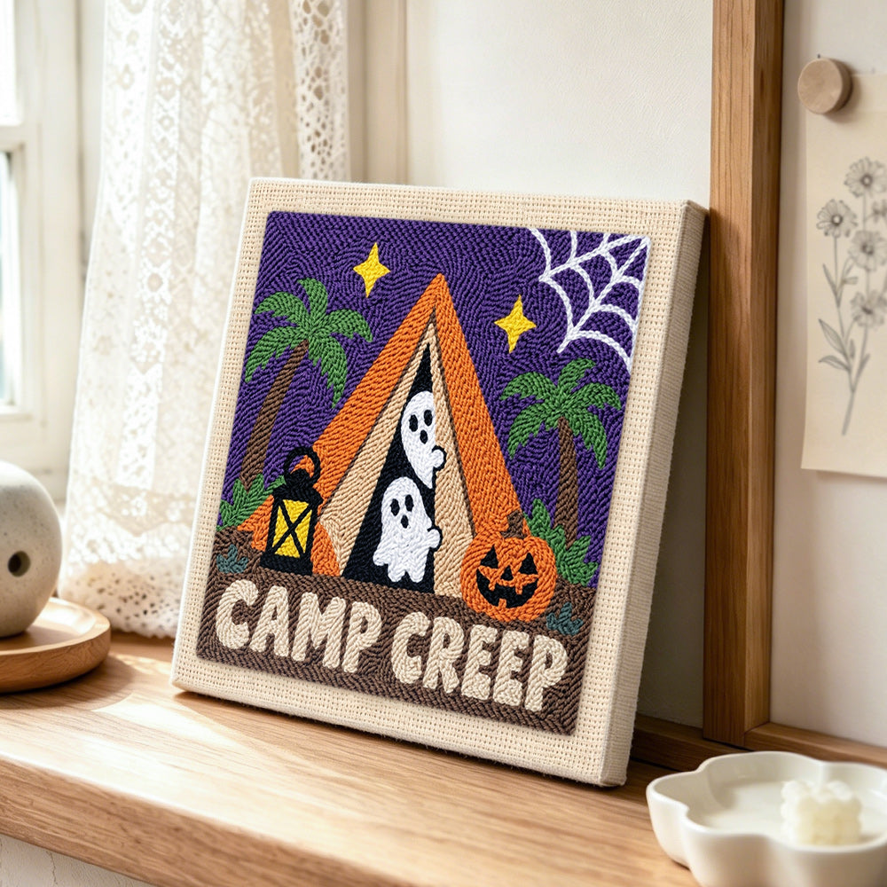 Spooky camp creep punch needle artwork displayed on a table