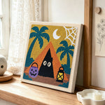 Spooky camping ghost punch needle artwork displayed on a table