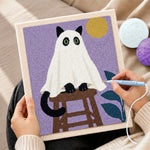 Creating handmade spooky ghost cat on stool punch needle artwork