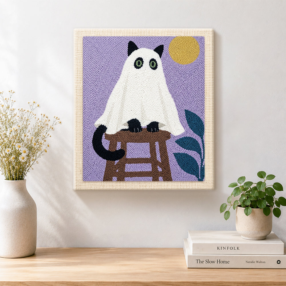 Finished spooky ghost cat on stool artwork displayed on a wall
