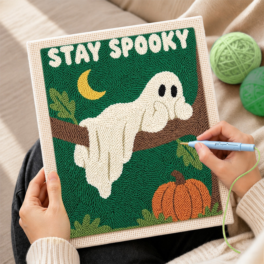 Creating handmade spooky ghost on tree branch punch needle artwork