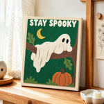 Spooky ghost on tree branch punch needle artwork displayed on a table