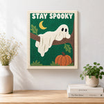 Finished spooky ghost on tree branch artwork displayed on a wall