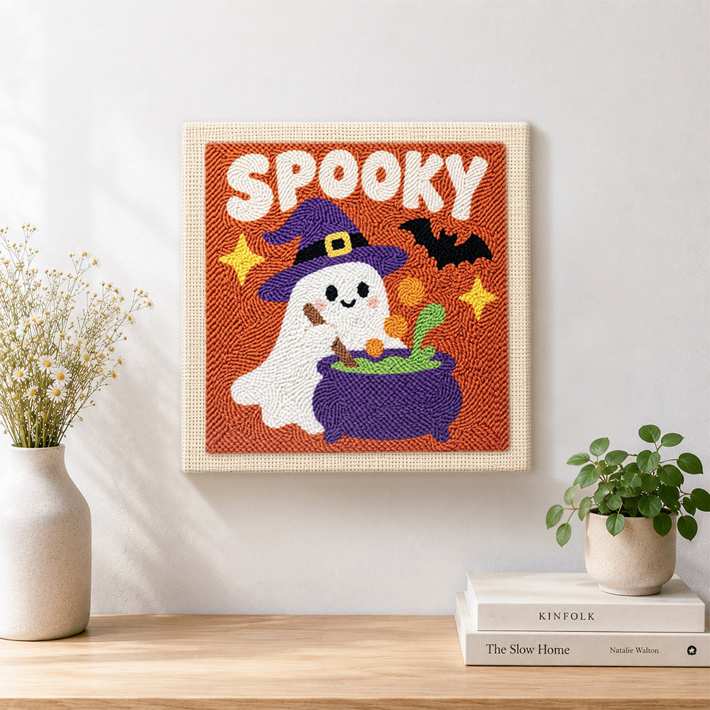 Finished spooky ghost with cauldron artwork displayed on a wall