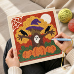 Creating handmade spooky halloween tree punch needle artwork