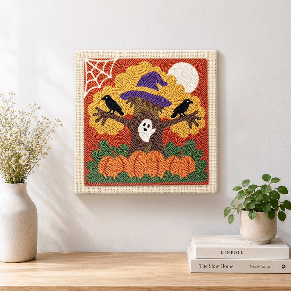 Finished spooky halloween tree artwork displayed on a wall